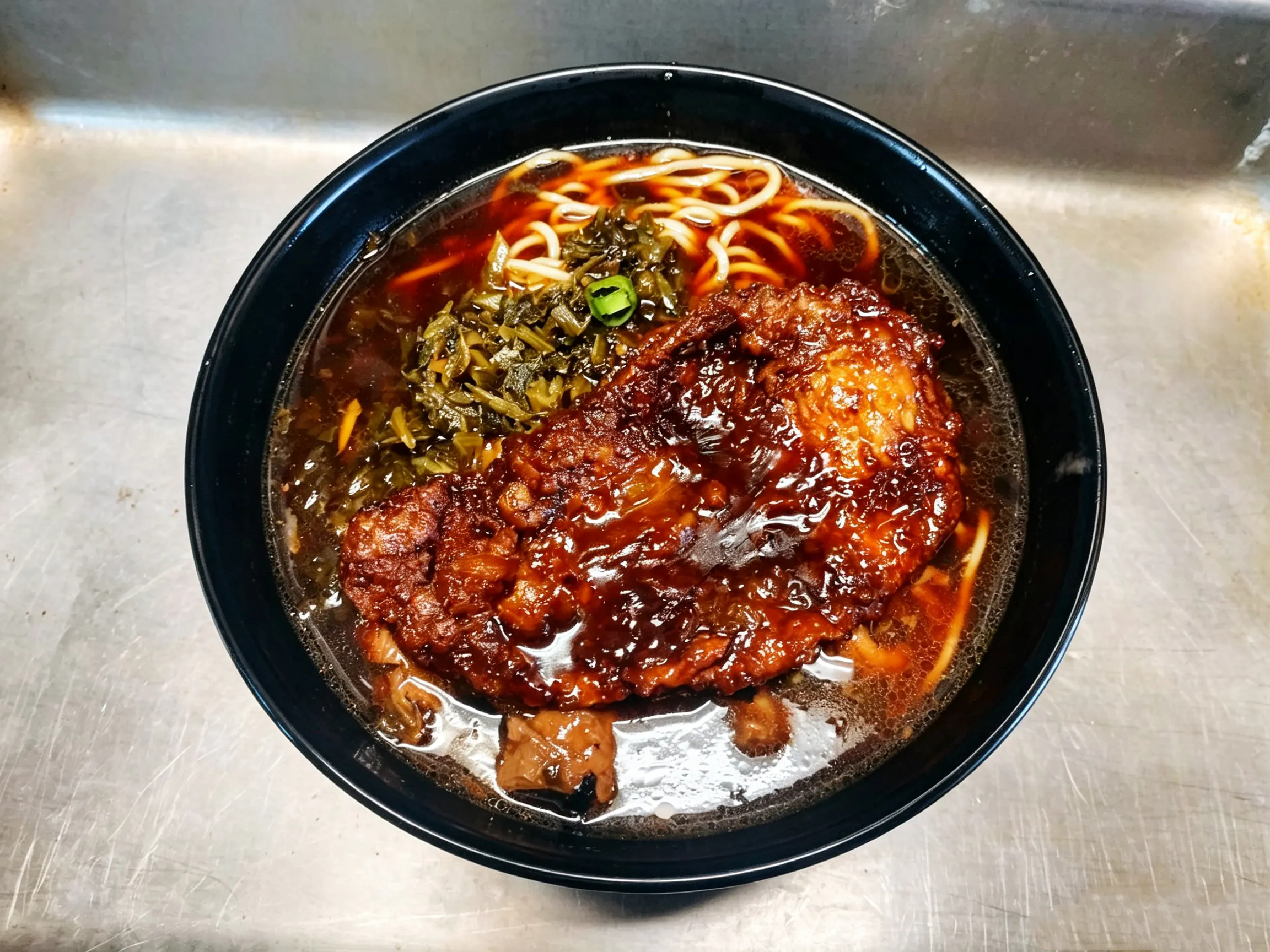 Noodle soup topped with thick braised pork steak and pickled vegetables at Yijia Kitchen，a Chinese Restaurant in Arcadia